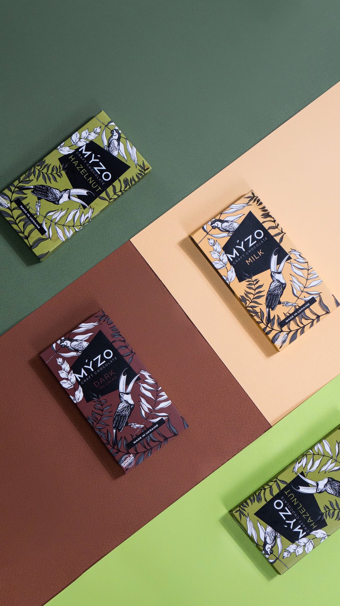 Four Myzo Chocolate bars in a colorful studio photo