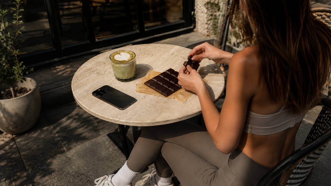 Girl eating chocolate at a cafe with matcha