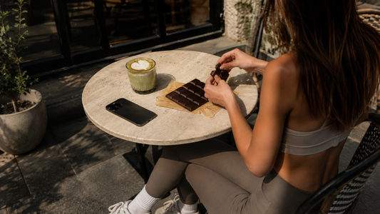 Girl eating chocolate at a cafe with matcha
